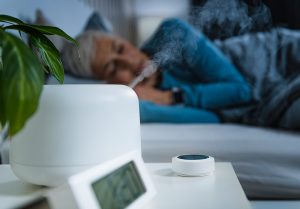 senior sleeping with a humidifier