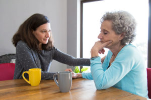 family caregiver comforting senior loved one